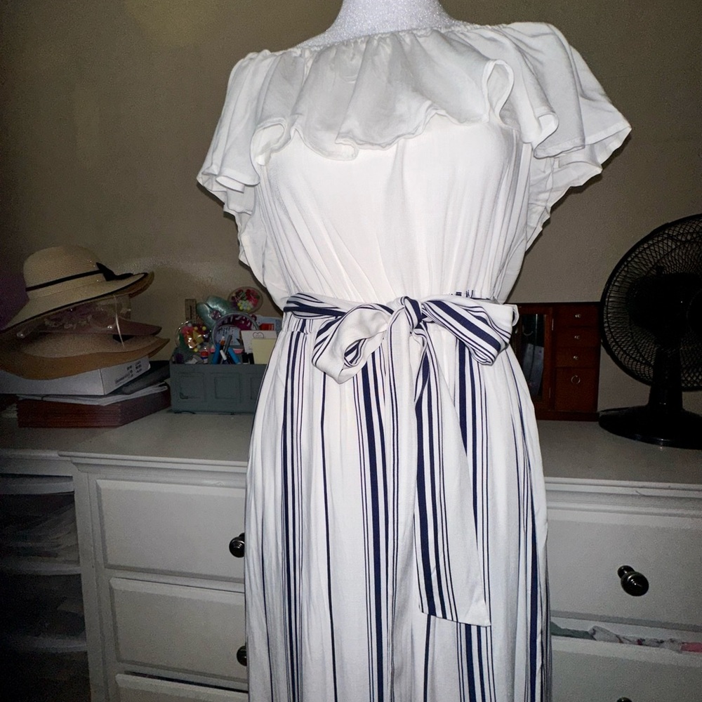 Dress pants. White fluffy top and navy blue and white bottom